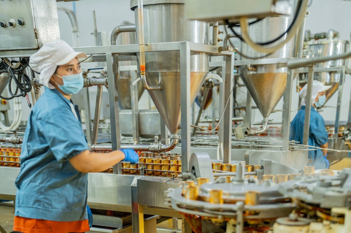 Factory worker in modern manufacturing facility — E-9 Visa Korea EPS Program